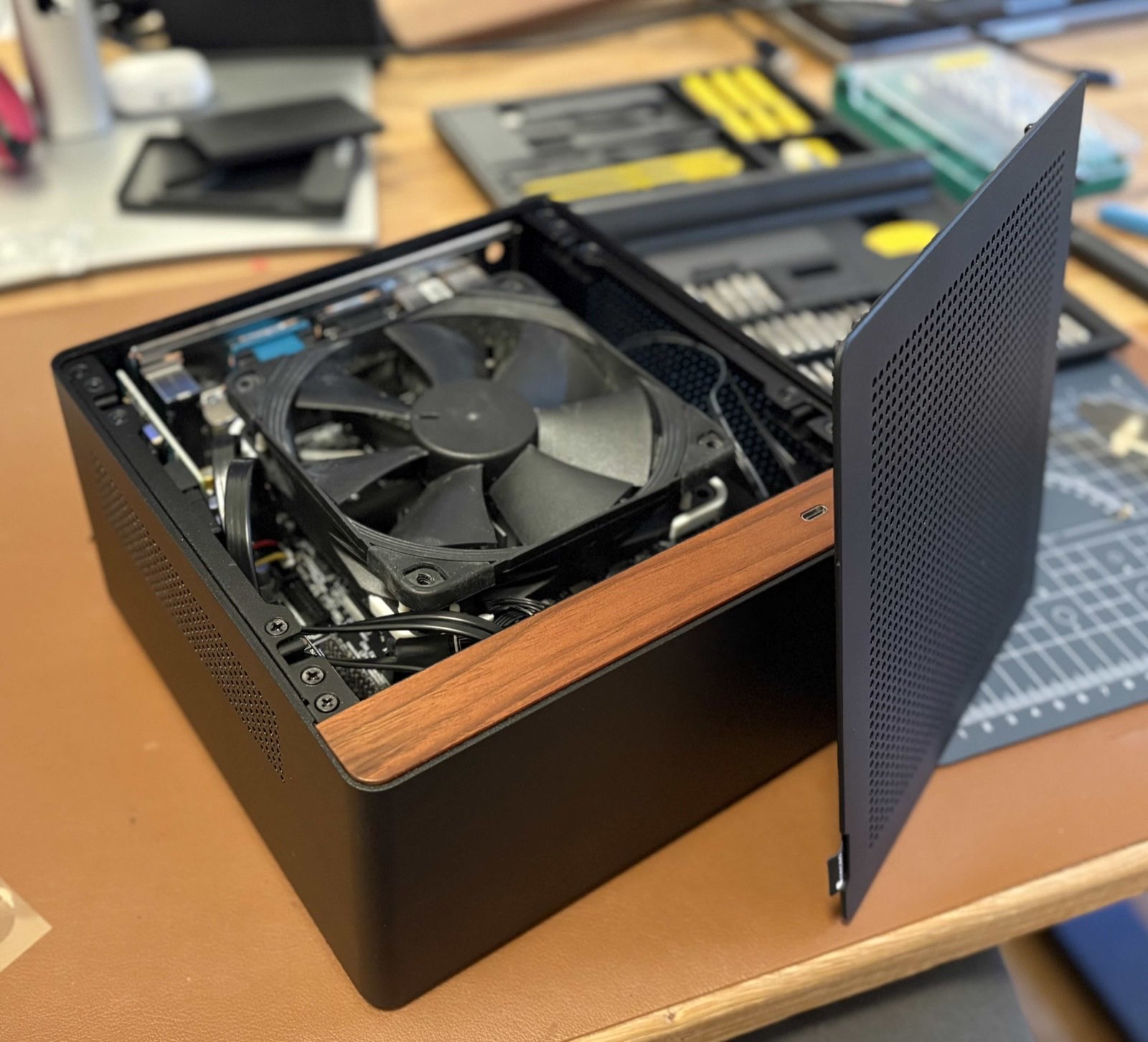 The NAS case open on a desk during assembly